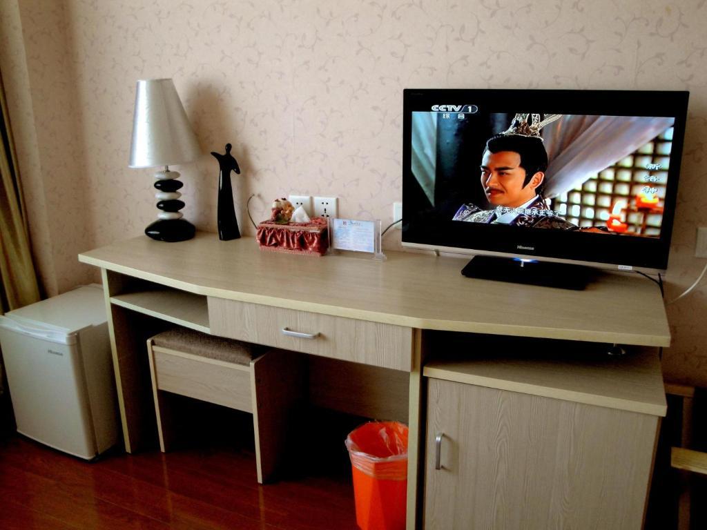 Overseas Chinese International Hotel Qingdao Quarto foto