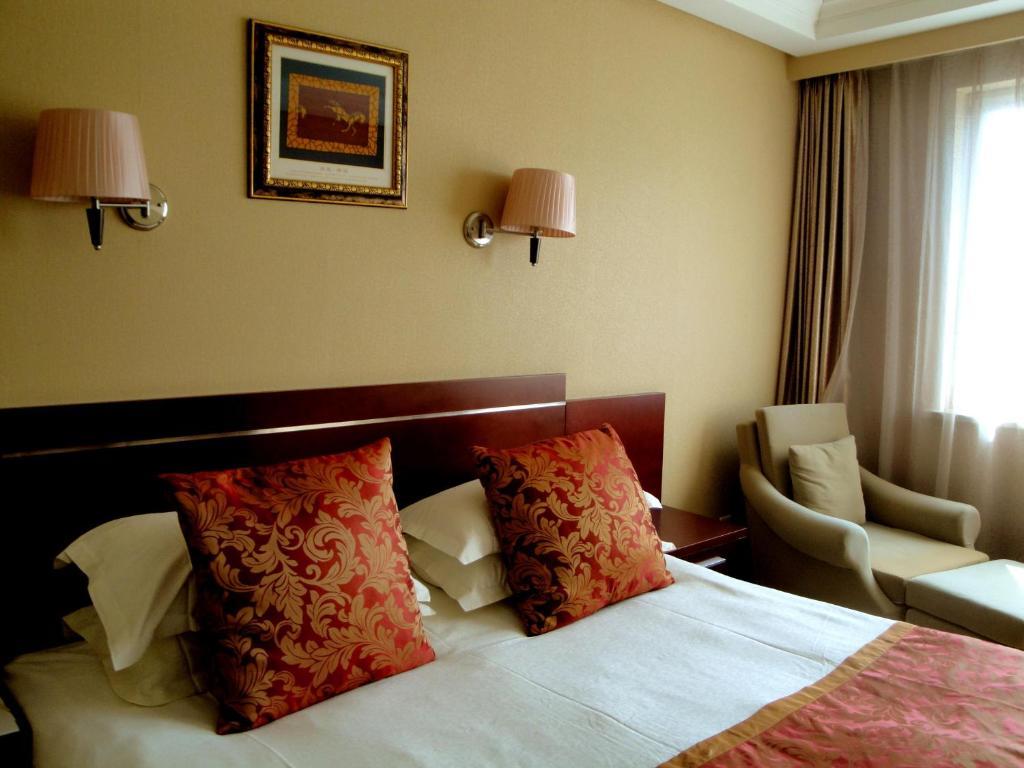 Overseas Chinese International Hotel Qingdao Quarto foto
